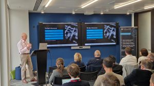 David Royle presenting at DeeperThanBlue's Agentic AI Event in London.