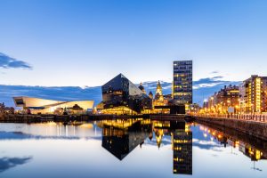 Liverpool Skyline building at Pier head and Albert Dock at sunset dusk, Liverpool England UK.